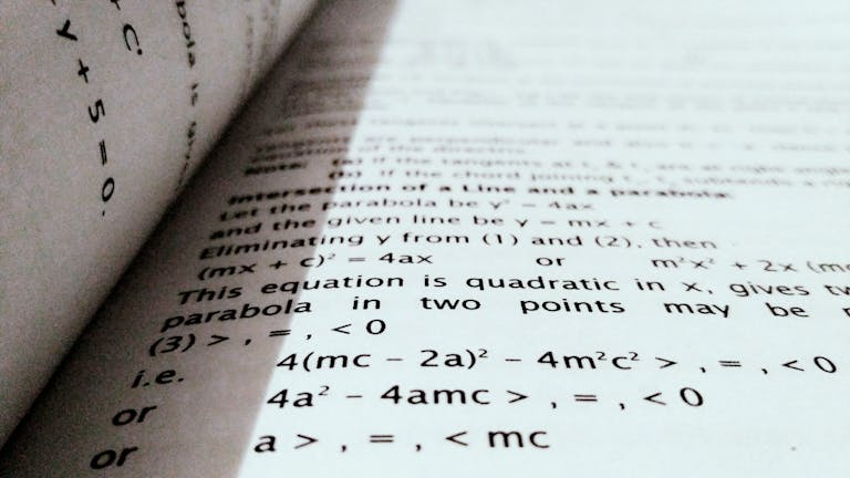 A close-up shot of mathematical equations on a book page, perfect for education and learning concepts.